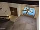 View of front door from above featuring tiled flooring, ceiling fan, and carpeted floor at 2050 W Nido Ave, Mesa, AZ 85202