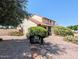 Charming home with well-maintained landscaping and a rustic walkway at 2050 W Nido Ave, Mesa, AZ 85202