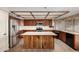 Well-equipped kitchen features a wooden island, stainless steel appliances, and tiled countertops at 2050 W Nido Ave, Mesa, AZ 85202