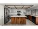 Bright kitchen featuring wooden island, stainless steel appliances, and tiled countertops at 2050 W Nido Ave, Mesa, AZ 85202