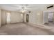 Spacious living room featuring large windows, neutral carpet, and great natural light at 2050 W Nido Ave, Mesa, AZ 85202
