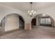 Sitting room showcasing a chandelier and arched doorways at 2050 W Nido Ave, Mesa, AZ 85202