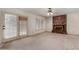 Cozy living room boasts a brick fireplace and outdoor access at 2050 W Nido Ave, Mesa, AZ 85202