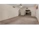 Expansive living room featuring archways to other rooms and a ceiling fan at 2050 W Nido Ave, Mesa, AZ 85202