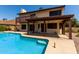 Backyard swimming pool with a covered patio and second story balcony at 2050 W Nido Ave, Mesa, AZ 85202