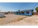 View of the backyard of the home, featuring a chain link fence and shed at 2117 W 2Nd St, Mesa, AZ 85201