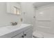 Clean bathroom featuring a vanity sink, mirrored cabinet, and shower at 2117 W 2Nd St, Mesa, AZ 85201