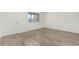 Bright bedroom with ample natural light, wood-look flooring, and a neutral color palette at 2117 W 2Nd St, Mesa, AZ 85201