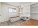 Bedroom with built-in desk, shelving, and wood-look flooring at 2117 W 2Nd St, Mesa, AZ 85201