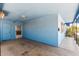 Covered carport features blue painted walls and ceiling, leading to the front porch at 2117 W 2Nd St, Mesa, AZ 85201