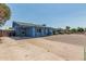 The exterior of this single story home is light blue with a covered front porch at 2117 W 2Nd St, Mesa, AZ 85201