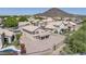 Aerial view showcases this tan home on a gravel lot near a landscaped pool, ideal desert living at 22019 N 59Th Dr, Glendale, AZ 85310