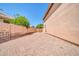 Spacious backyard featuring gravel landscaping, a block fence, and plenty of room for customization at 22019 N 59Th Dr, Glendale, AZ 85310