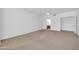 Spacious bedroom with neutral carpet and access to ensuite bathroom at 22019 N 59Th Dr, Glendale, AZ 85310