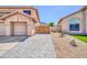 Private home featuring a paved walkway to the front gate and low-maintenance landscaping at 22019 N 59Th Dr, Glendale, AZ 85310