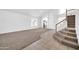 Inviting foyer featuring a staircase, tile flooring, and seamless access to living areas at 22019 N 59Th Dr, Glendale, AZ 85310