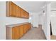 Hallway with built-in cabinets and neutral colored carpet flooring at 22019 N 59Th Dr, Glendale, AZ 85310