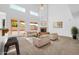 Spacious living room features high ceilings, a fireplace, and access to the outdoor area at 22019 N 59Th Dr, Glendale, AZ 85310