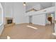 Bright living room with hardwood floors, high ceilings, and a modern fireplace at 22019 N 59Th Dr, Glendale, AZ 85310