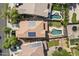A high angle shows the backyard pool and surrounding homes in the neighborhood at 2213 N Park Meadows Dr, Buckeye, AZ 85396