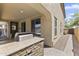Outdoor kitchen featuring a built-in grill and stone countertops, perfect for entertaining at 2213 N Park Meadows Dr, Buckeye, AZ 85396