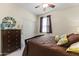 Bedroom with queen bed, dresser, decor items, and a ceiling fan at 2213 N Park Meadows Dr, Buckeye, AZ 85396