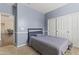 Cozy bedroom featuring neutral walls, carpet floors, and a sliding door closet at 2213 N Park Meadows Dr, Buckeye, AZ 85396