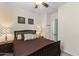 Cozy bedroom with a queen bed, neutral walls, and a ceiling fan at 2213 N Park Meadows Dr, Buckeye, AZ 85396