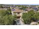 A front aerial shows a two-story home shaded by mature trees and a well manicured lawn at 2213 N Park Meadows Dr, Buckeye, AZ 85396