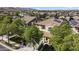 View of a two-story home with tile roof, desert landscaping, and a view of the mountains in the distance at 2213 N Park Meadows Dr, Buckeye, AZ 85396