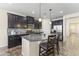 Kitchen with dark wood cabinets, stainless steel appliances, and granite countertops at 2213 N Park Meadows Dr, Buckeye, AZ 85396