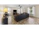Comfortable living room with a large sectional sofa and a ceiling fan at 2213 N Park Meadows Dr, Buckeye, AZ 85396