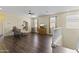 Spacious living room with hardwood floors, large windows, and a ceiling fan at 2213 N Park Meadows Dr, Buckeye, AZ 85396