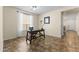 Home office with a desk, tile flooring, a big window and a serene and well-lit workspace at 2213 N Park Meadows Dr, Buckeye, AZ 85396