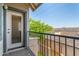This is a balcony with an iron railing and a door to the interior at 2311 E Hartford Ave # 29, Phoenix, AZ 85022