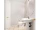Bathroom featuring pedestal sink, toilet, tile flooring, and neutral wall paint at 2311 E Hartford Ave # 29, Phoenix, AZ 85022