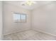 This bedroom has neutral walls, carpet, a window with blinds, and a ceiling fan at 2311 E Hartford Ave # 29, Phoenix, AZ 85022