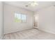 Comfortable bedroom with carpet, a ceiling fan, and access to the outdoor patio at 2311 E Hartford Ave # 29, Phoenix, AZ 85022