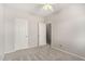 Spacious bedroom features carpet floors, neutral paint, ceiling fan, and two entry doors at 2311 E Hartford Ave # 29, Phoenix, AZ 85022