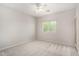 Bright bedroom with neutral carpet, ceiling fan and a window for natural light at 2311 E Hartford Ave # 29, Phoenix, AZ 85022