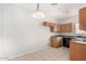 Well-lit kitchen with ample cabinet space and essential appliances at 2311 E Hartford Ave # 29, Phoenix, AZ 85022