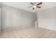 Spacious living room with tile flooring and staircase to upper level at 2311 E Hartford Ave # 29, Phoenix, AZ 85022