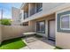 Private patio with artificial grass outside this townhome. A perfect place to relax at 2311 E Hartford Ave # 29, Phoenix, AZ 85022