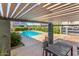 Community pool surrounded by lounge chairs and greenery, perfect for relaxing in the sun at 2311 E Hartford Ave # 29, Phoenix, AZ 85022