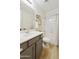 Clean bathroom with a gray vanity, white countertops, and a shower-tub combo at 2501 S Roanoke St, Gilbert, AZ 85295