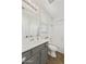 Bright bathroom featuring a gray vanity, neutral walls and tile flooring, and a shower-tub combination at 2501 S Roanoke St, Gilbert, AZ 85295