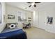 Bright bedroom with large closet, desk, and a metal bed frame with a soccer ball accent pillow at 2501 S Roanoke St, Gilbert, AZ 85295