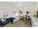 Bright bedroom featuring a bed with unique decorations, ceiling fan, and carpet flooring at 2501 S Roanoke St, Gilbert, AZ 85295