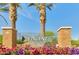 Welcoming community entrance with stone pillars, vibrant flowers, and 'Vincenz' signage at 2501 S Roanoke St, Gilbert, AZ 85295