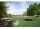 Lush community park with green grass, mature trees, and walking paths for outdoor recreation at 2501 S Roanoke St, Gilbert, AZ 85295